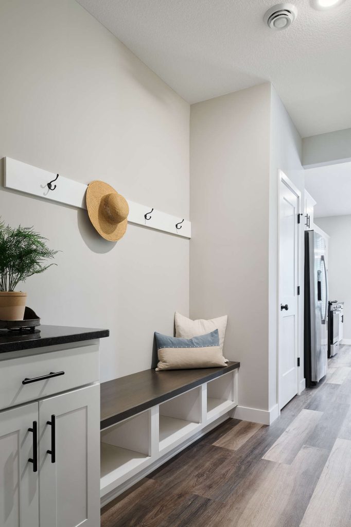 Modern entryway with bench and hooks