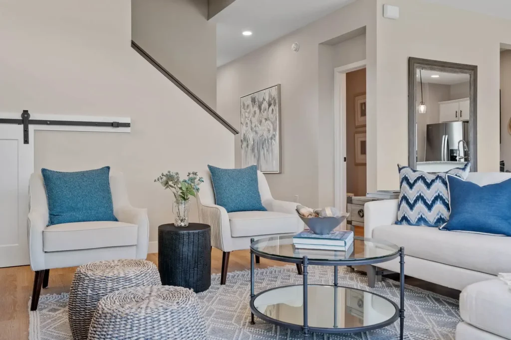 Modern living room with blue accent pillows.