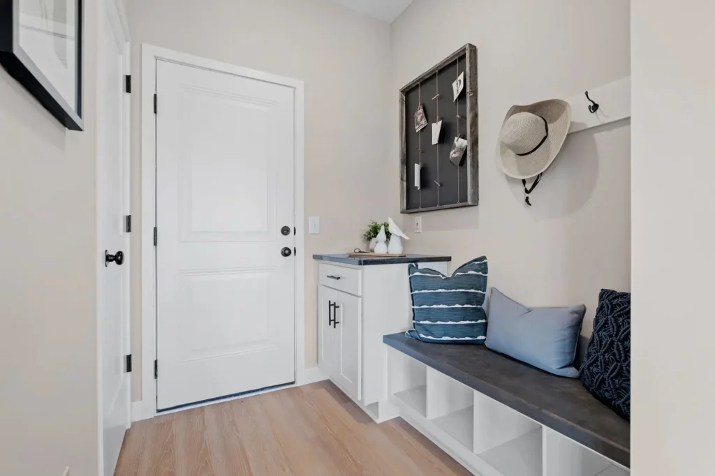 Cozy mudroom with storage and seating bench.